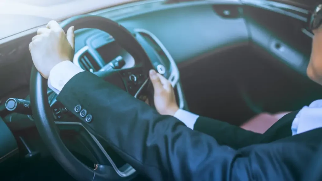 Luxury private car parked near San Diego Airport for pickup from Coronado Island